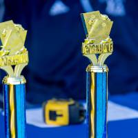 Blue trophies with Cornhole on top